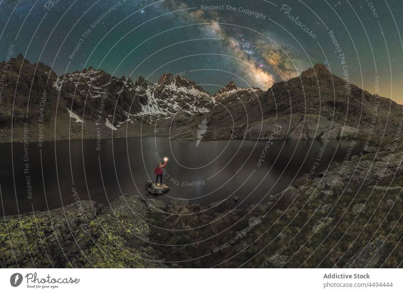 Anonymous traveler contemplating mountains and pond under Milky Way milky way circo de gredos nature sierra de gredos highland landscape laguna grande astronomy