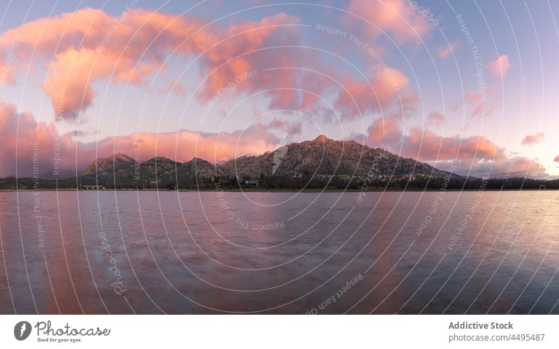 Rippling sea against steep mountain water rock nature coast waterside evening sunset shore environment scenic aqua flow river waterfront slope ridge ripple