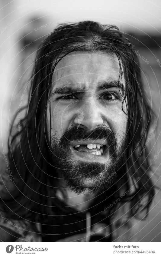 Young man with gap teeth and long hair Tooth space Man Facial hair youthful Face portrait Masculine Human being Black & white photo Adults skater