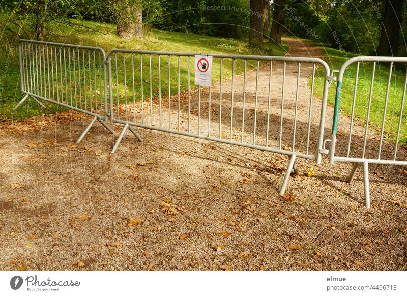 Barrier fence and sign signal that the parkway may not be entered / danger spot / warning notice Protective Grating Park off Park path tree breakage