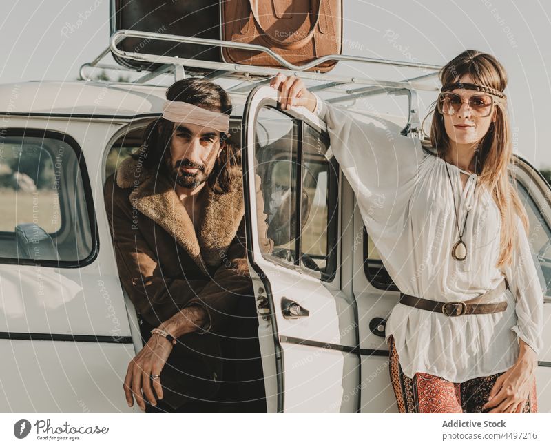 Hippie couple in vintage car relationship hippie retro nature journey trip freedom countryside vehicle summer travel love boho bonding guy fondness transport