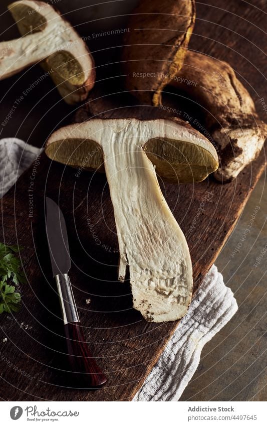 Boletus edulis on cutting board boletus edulis mushroom raw fungus cook specie organic food culinary natural edible yummy delicious cap stem fresh product