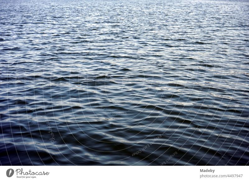 Light waves on the dark shimmering water surface of the Poyrazlar Gölü near Adapazari in summer sunshine in the province of Sakarya in Turkey Water Lake