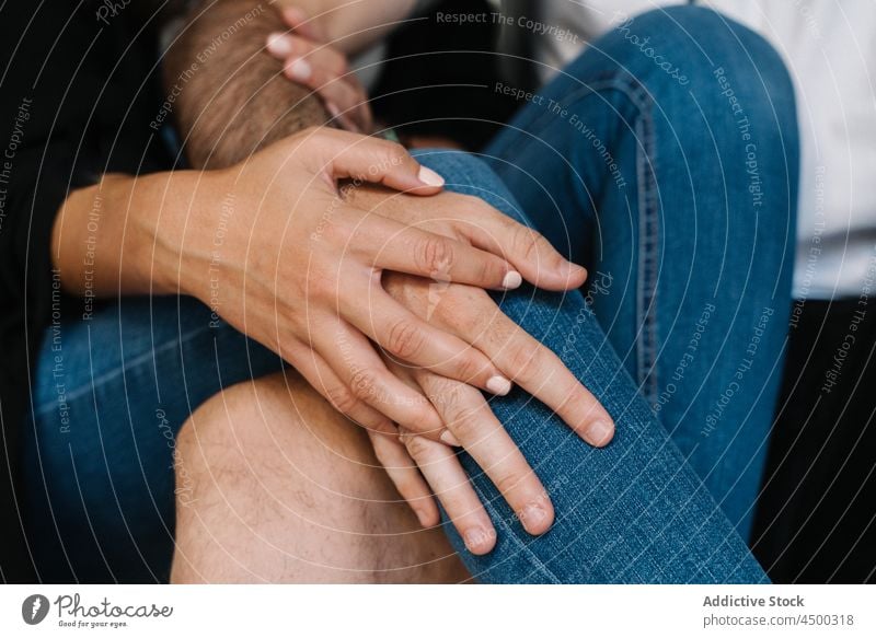 Anonymous couple holding hands while they are sitting on street relationship love together city romantic bonding affection spend time close stroll boyfriend