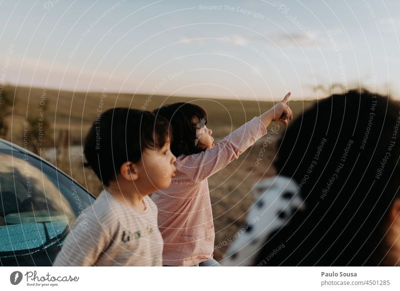 Cute girl pointing at the sky Child Girl Boy (child) Mother with child Family & Relations 1 - 3 years 3 people family Together togetherness Point Infancy