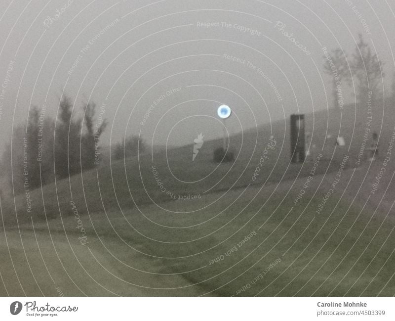 A luminous clock defies a foggy morning on a golf course Fog Clock Gloomy Deserted Exterior shot Nature Landscape Copy Space top Environment Day Gray