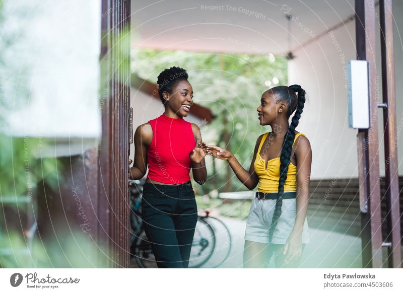 Two girlfriends having fun in the city youth sisterhood attractive real people millennials cool diversity black friendship together girls summer beautiful