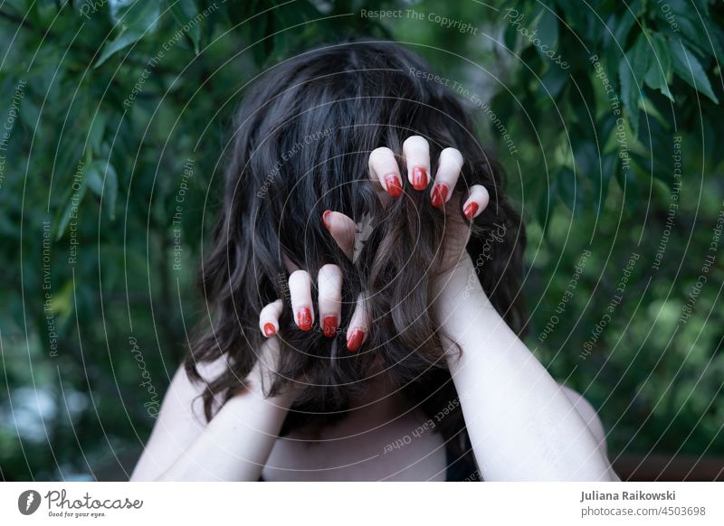 Woman shows her claws hands hair Hair and hairstyles Head Human being No face Adults 1 nails Forest Fear person Lonely Pain unhappy Curl on one's own Brunette