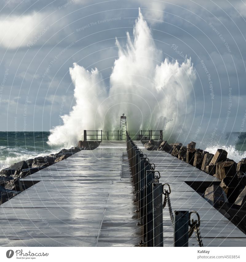 Lighthouse on the pier of Norre Vorupor during storm and heavy sea, Jutland, Denmark Gale Waves Weather Hurricane Mole coast Sea State Ocean ocean North Sea