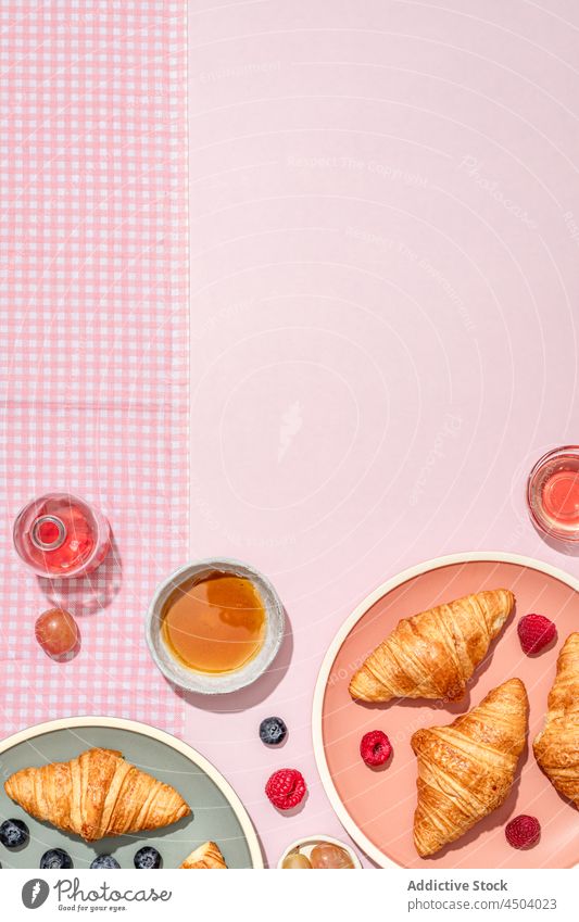 Plates with tasty croissants served with jam and berries placed on table dessert sweet breakfast food pastry delicious morning fresh yummy berry composition