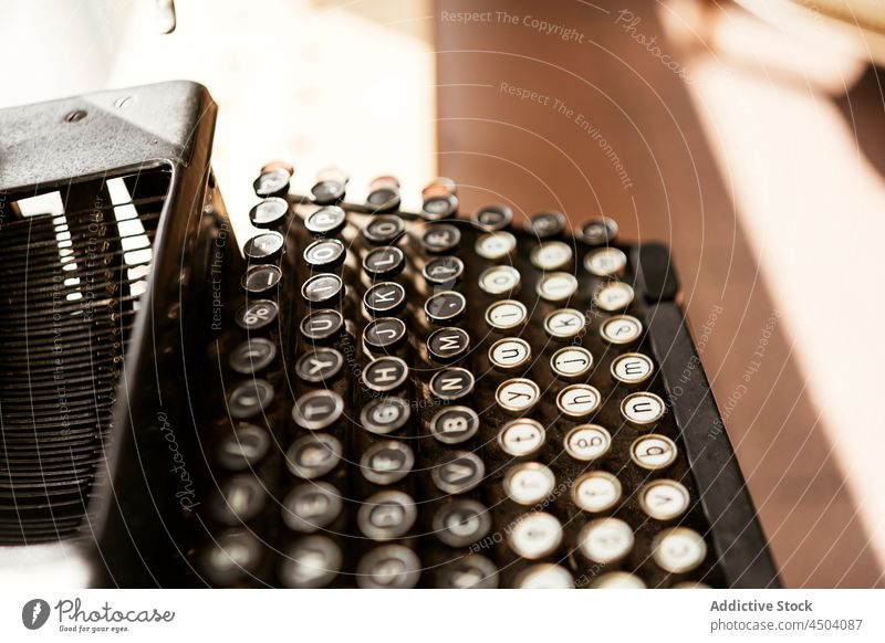 Aged retro typewriter in sunlight vintage nostalgia button old old fashioned antique keyboard aged table letter classic colorful machine design old timer