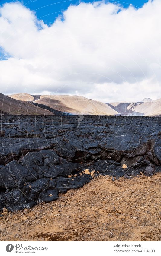 Dry black lava near volcano in daylight picturesque rough nature highland volcanic formation spectacular dry fagradalsfjall iceland landscape terrain geology