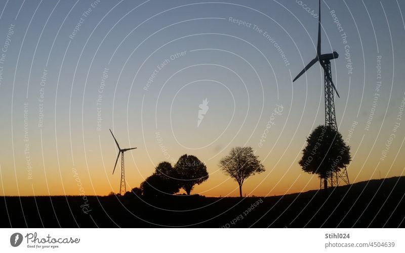 Wind turbine on lattice mast in the evening glow Pinwheel wind power Energy Utilities stream generator Color gradient Twilight Evening Horizon Silhouette