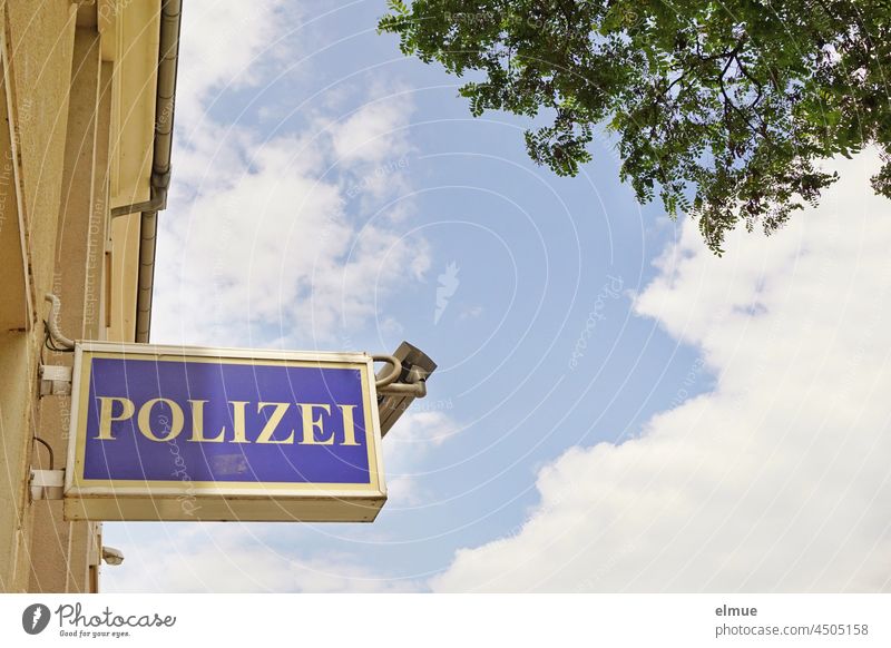 Signs I Sign - Police - and a surveillance camera at the entrance to the police station. sign Police Force Surveillance camera Building Worm's-eye view Tree