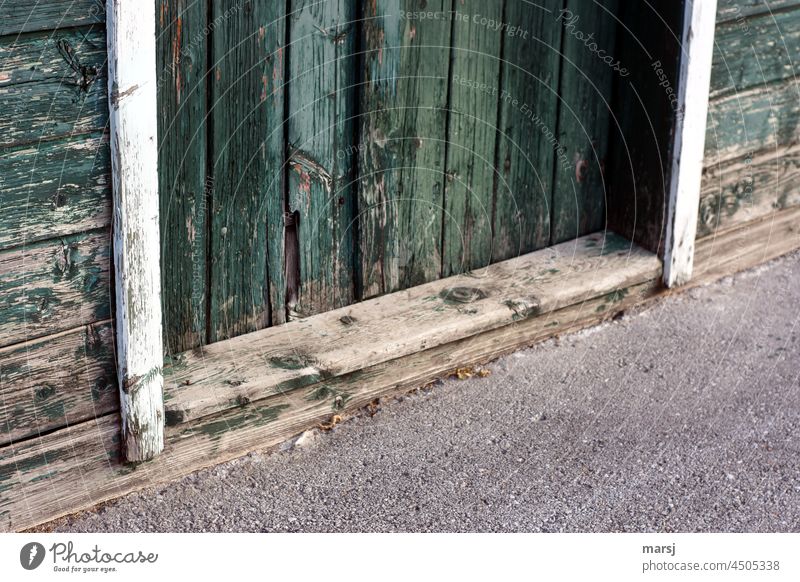 Front door threshold. Threshold fears of what may come. Weathered Old weathered wood Close-up Detail Wood Fear of the future uncertainty Subdued colour