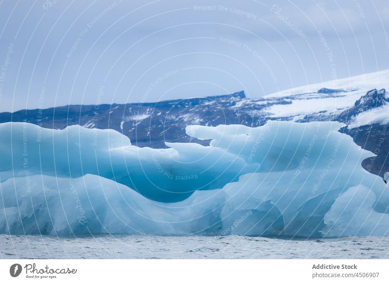 Scenic landscape of glacier lake against cloudy sky mountain snow nature winter iceberg float picturesque breathtaking range jokulsarlon iceland scenery ridge