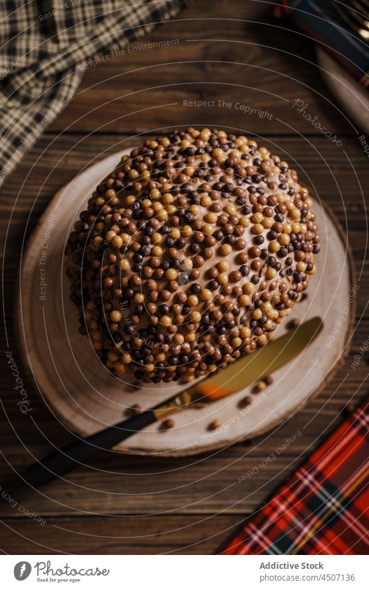 Cake with sweet topping on wooden stand panettone dessert christmas serve tradition homemade celebrate sprinkle new year holiday tasty delicious festive winter