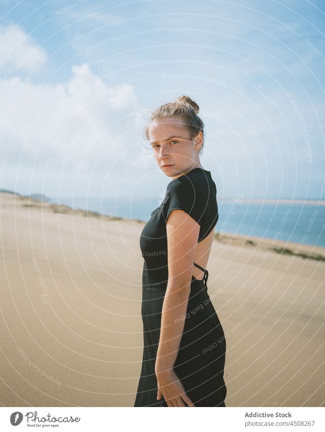 Woman in dress walking on sandy dunes woman desert arid hot harmony elegant exotic freedom female serene environment hill explore heat sunlight drought