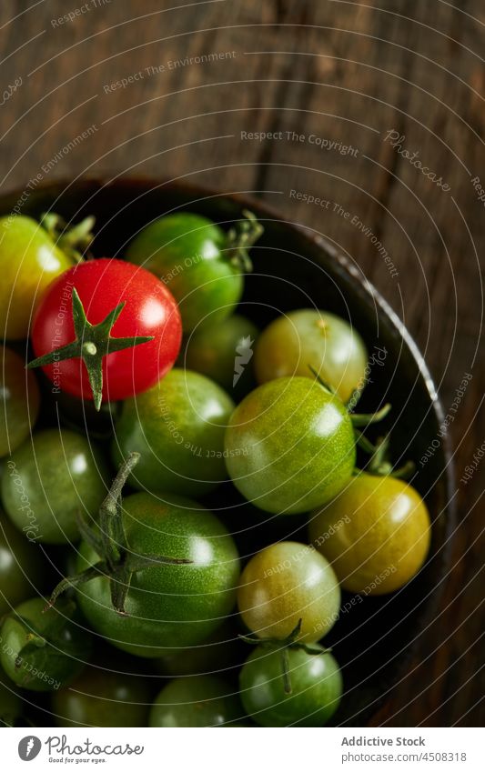 Bowl with red and unripe cherry tomatoes harvest farm bowl cultivate agriculture vegetable food whole season healthy vitamin many agronomy countryside farmland