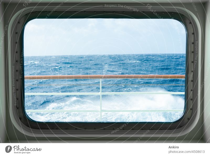 View from a cabin window of a cruise ship on the stormy sea atlantic ocean ocean waves ocean horizon splashing wild dramatic sky travel foam rolling heavy water