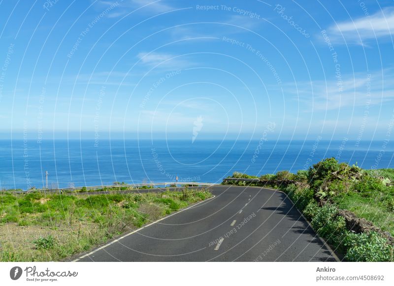 Road along the coast on the island of La Palma, Spain coastal road street landscape travel atlantic ocean blue nature sky beautiful tourism village scenic