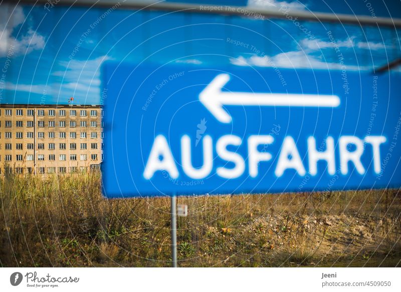 Signs | A demolition site and its exit Signs and labeling Signage Sky Blue Arrow Decline Derelict Block Prora Rügen Historic construction Gigantic Window Many