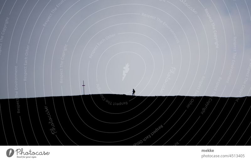 Encounter between man and the cross Crucifix Human being pilgrim path hike Christianity Christian cross Religion and faith Church Belief Symbols and metaphors