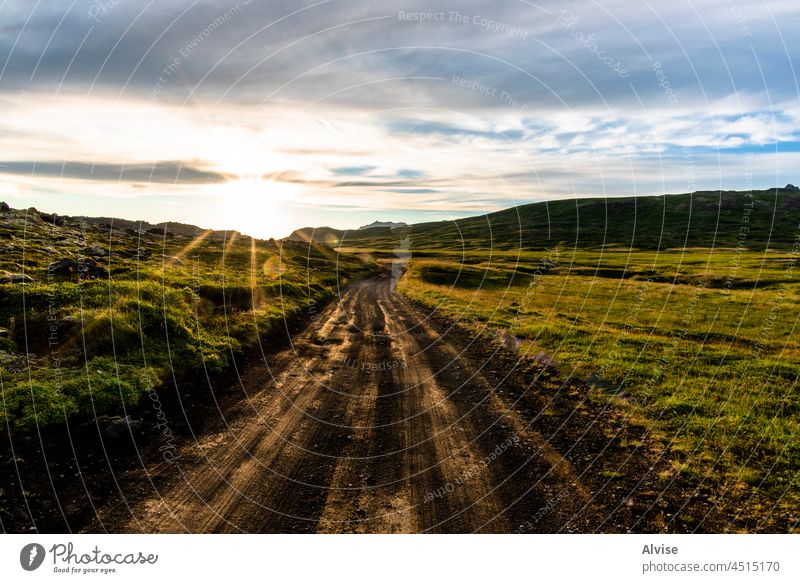 2021_08_10_snaefellsnes lava field 3 nature dawn landscape grass sky gravel evening mood outdoor lava stones cloudy water view hill sunset volcanic scenery