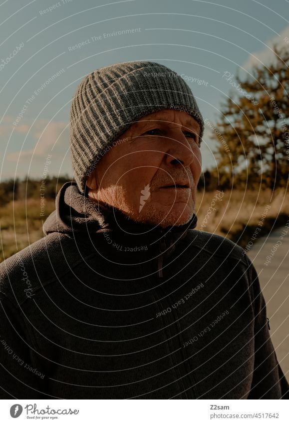 Casual pensioner taking a walk annuity Retirement stroll Contentment fortunate Blonde Nature Landscape light blue Sky Autumn autumn colours portrait chill