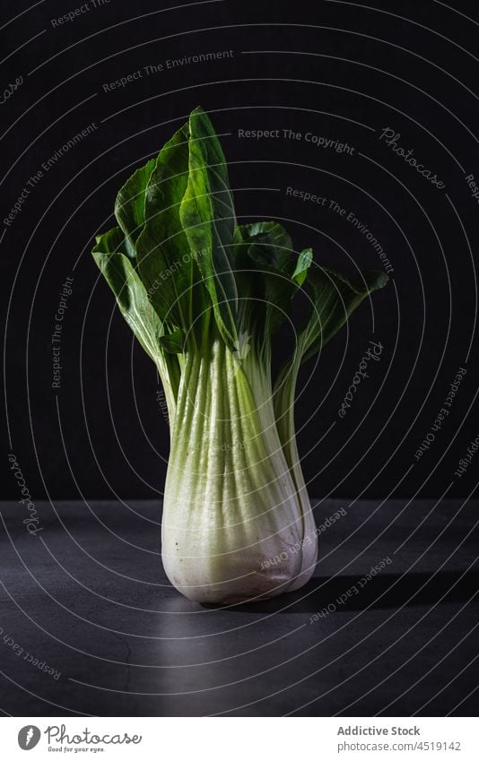 Chinese cabbage on black table in studio chinese cabbage vegetable bok choy pak choy food healthy leaf diet healthy food vitamin fresh plant raw studio shot