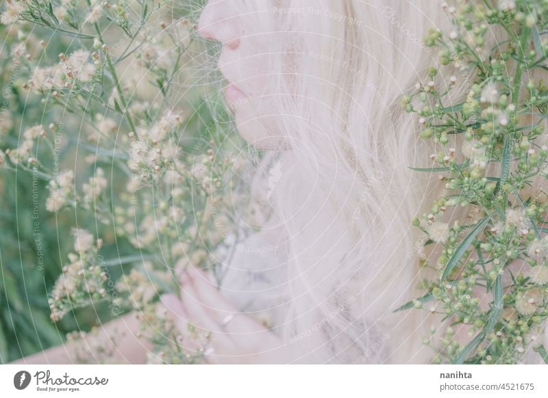 Artistic and reamy portrait of a woman surrouded by nature forest fantasy fairy delicate albino fairy tale feminine femininity long hair white caucasian pale