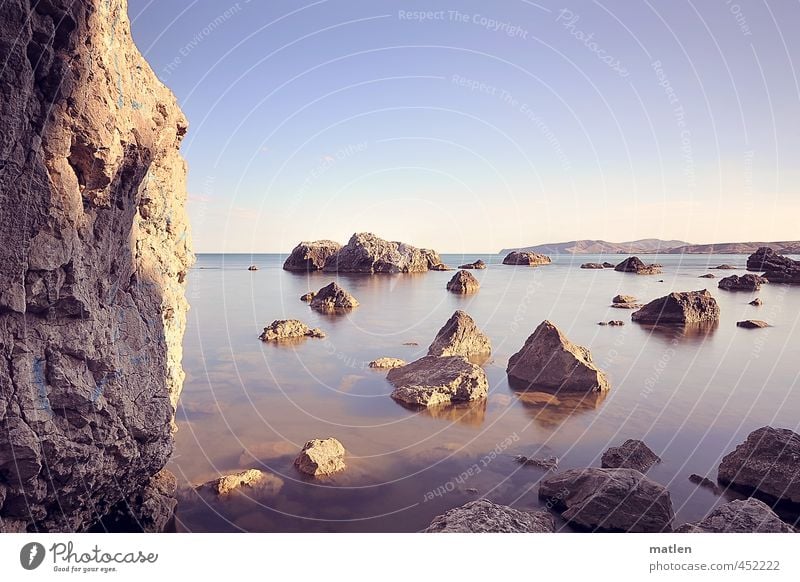 next to the greenhouse Landscape Water Sky Cloudless sky Horizon Sunrise Sunset Summer Weather Beautiful weather Rock Coast Ocean Deserted Blue Brown Violet