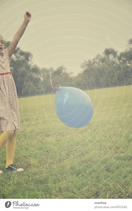 the blue balloon . Child Girl out game Meadow Grass Balloon Retro