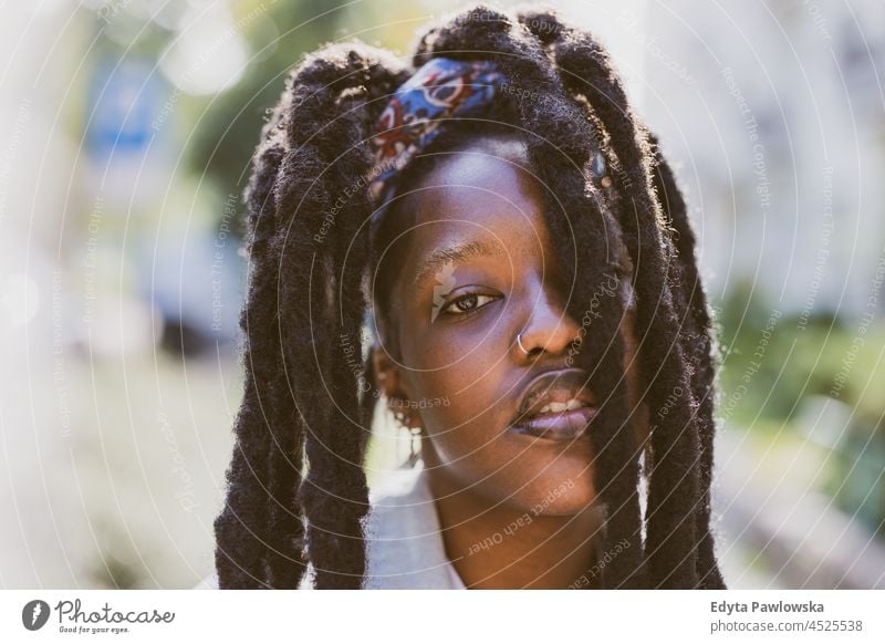 Portrait of beautiful young woman outdoors unaltered natural real people authentic body inclusivity body positive one person hipster girl hairstyle dreadlocks