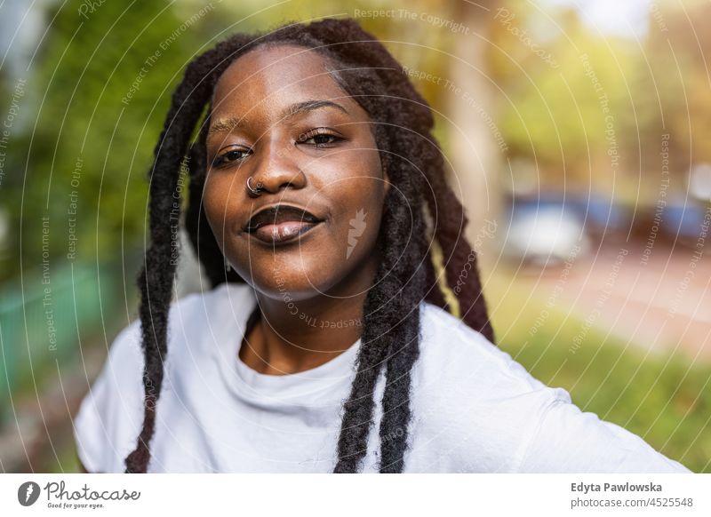 Portrait of confident young woman outdoors unaltered natural real people authentic body inclusivity body positive one person hipster girl hairstyle dreadlocks