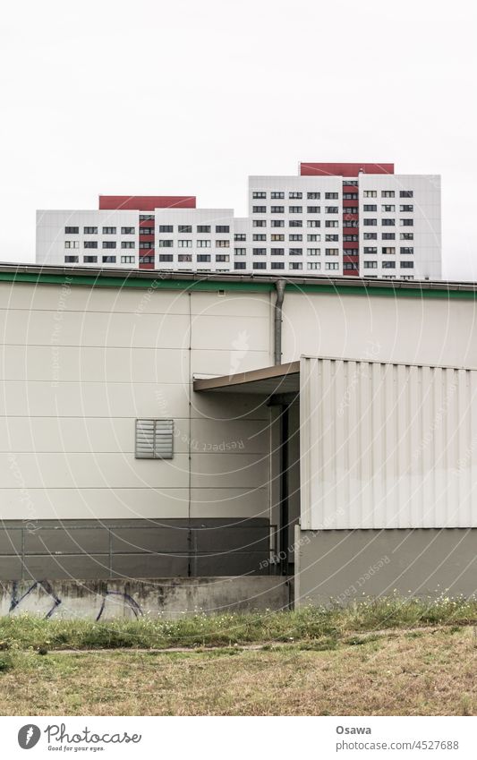 High-rise building behind fallow land / barrack Apartment Building Prefab construction FALLOW LAND Facade Architecture November Window Town Manmade structures