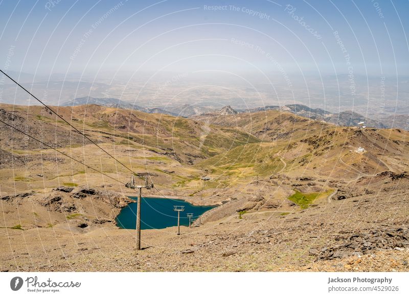 Cable car from ski resort Sierra Nevada through Sierra Nevada National Park, Spain cable car spain sierra nevada mountains landscape copy space