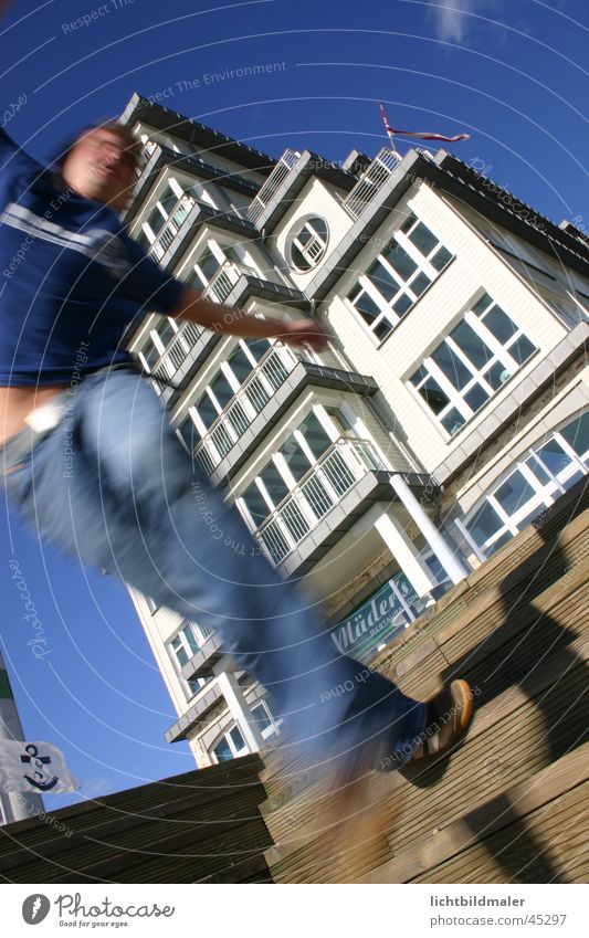 A man falls Motion blur To fall Man Sudden fall Blue sky Perspective