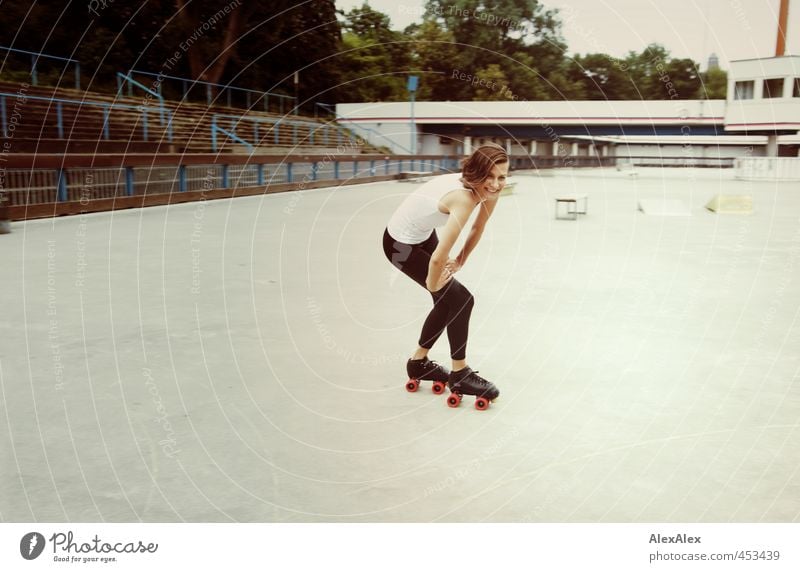 young woman on roller skates on a roller skating rink Joy Athletic Rollerskating Sporting Complex Skater circuit Young woman Youth (Young adults) 18 - 30 years