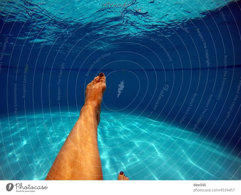 Woman in pool, legs under water pool party Swimming & Bathing be afloat Swimming pool Summer Summer vacation Vacation & Travel Wet Exterior shot Relaxation