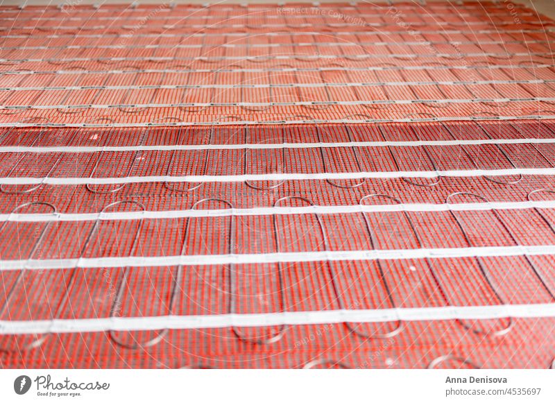 Process of instalation of electric underfloor heating mats installing indoor domestic home house cable installation thermal warm interior room hot grid