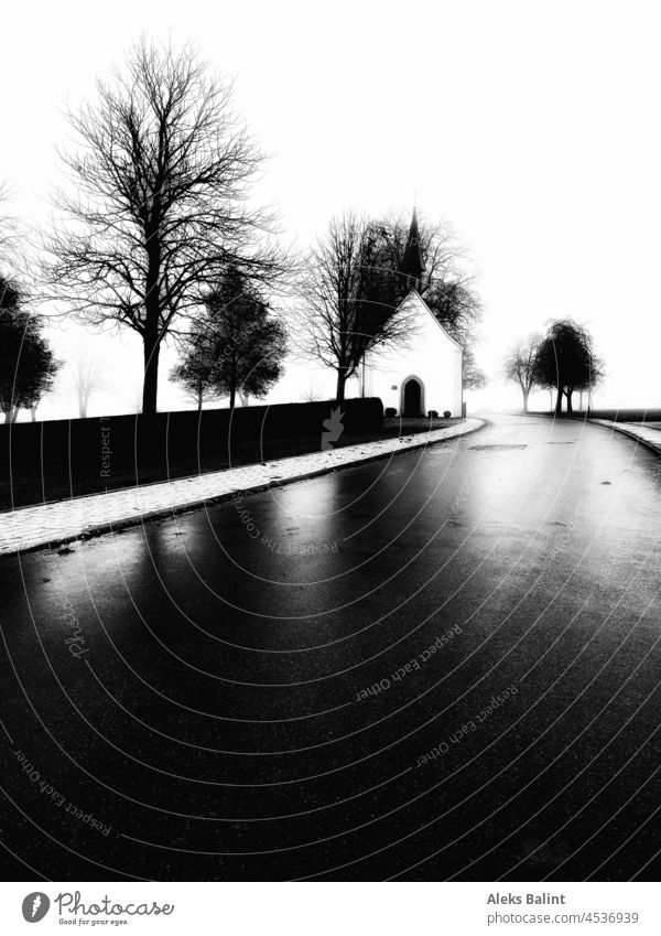 A small chapel at a street framed by some trees in black and white Chapel Street black-and-white Black & white photo Exterior shot Deserted Landscape Autumn