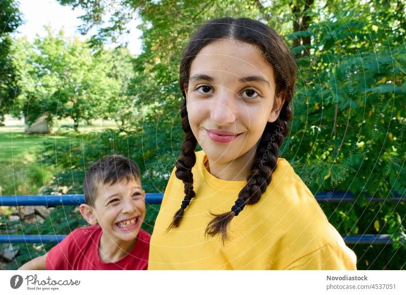 Portrait of a teenage girl and her younger brother Girl Boy (child) Lifestyle togetherness Caucasian Authentic Sister Together Exterior shot Family & Relations