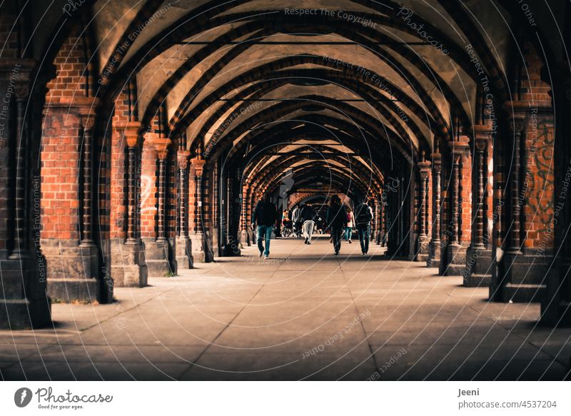 People stroll across the Oberbaum Bridge Oberbaumbrücke Berlin Capital city people Landmark Spree Manmade structures Kreuzberg Friedrichshain Tourist Attraction