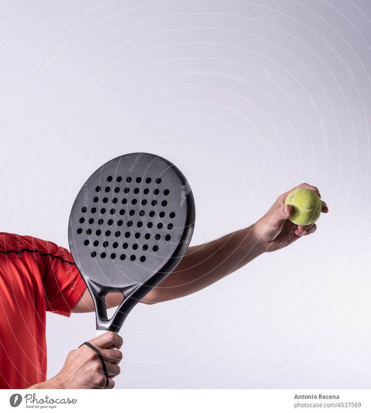 Studio shot of paddle tennis player, hands and racket ready for serve padel sport sports recreation anonymous body parts studio shot man men male ball