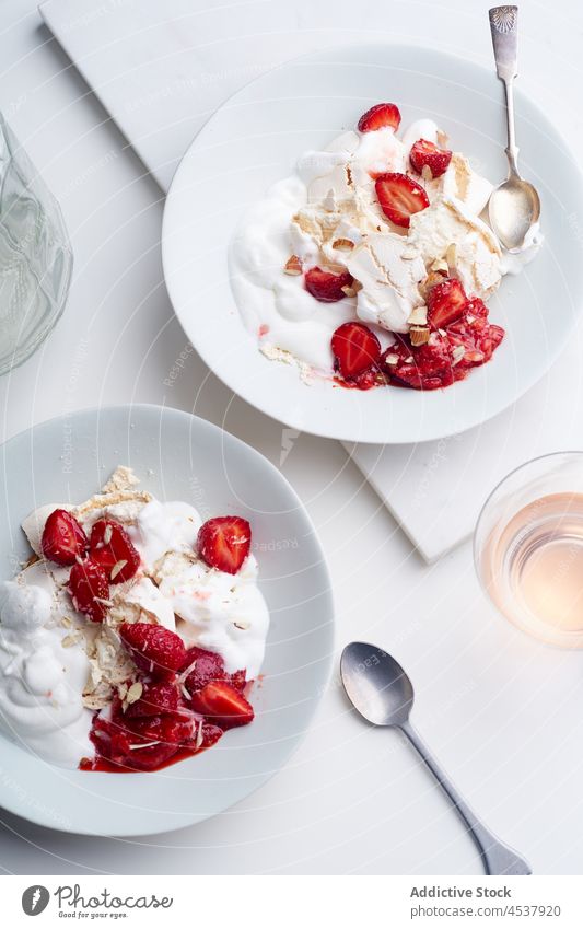 Dessert with berries, crushed meringue and whipped cream dessert eton mess sweet strawberries berry food red fresh english fruit white summer epicure cookery