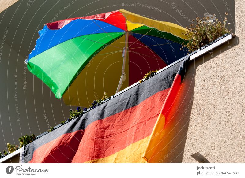 Flag of Germany in summer in front of the balcony German flag Balcony Patriotism Ensign Pride Sunshade variegated Perspective Sunlight Summer Freedom