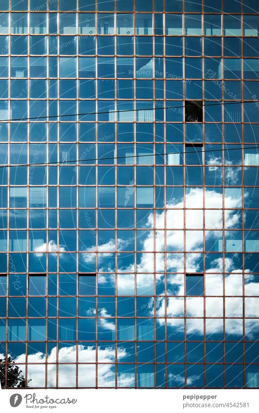 Clouds reflected on the glass facade of a skyscraper Clouds in the sky reflection Reflection Sky Blue Exterior shot High-rise High-rise facade