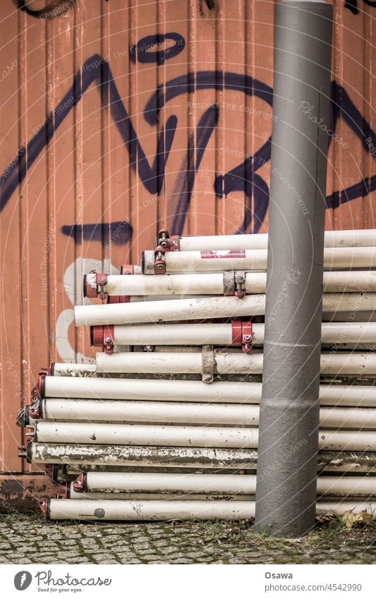 construction site Construction site Lantern lamppost Container Corrugated sheet iron Fence Deserted Colour photo Structures and shapes Abstract Pattern Graffiti