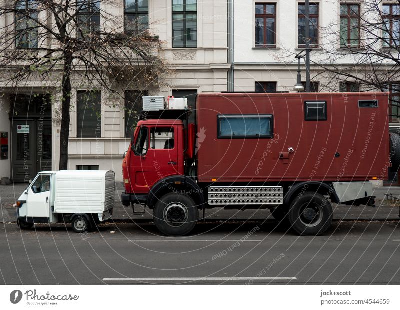 small van with three wheels meets big truck with living cabin Schönhauser Allee Prenzlauer Berg Berlin Parking Street Tricycle Transporter lorry Truck